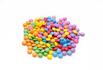 Bright chocolate dragee in a multicolored glaze on white