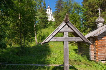 Chapel and cross at the burial place of the Holy Martyr Peter Zverev Archbishop of Voronezh in the Golgotha-Crucifix skete at Mount Calvary on Anzersky Island, Solovki Islands,