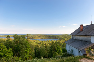 Fototapety  View of the island of Anzersky, monastery building, and the White Sea from Mount Calvary on Anzersky Island, Solovki Islands, Arkhangelsk Region, Russia