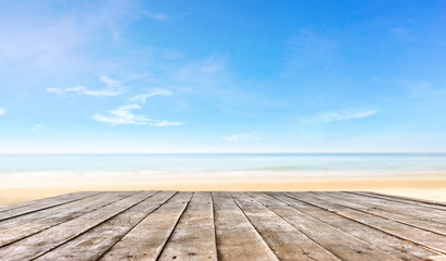 Fototapeta na wymiar wooden table top or wooden plank in front of the beach background