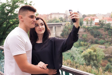Lovers guy with a girl take a selfie