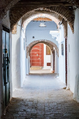 Naklejka premium Narrow medieval street in the white medina of the Tetouan city, Morocco in Africa