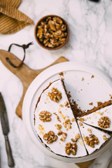 Carrot Cake with Cream Cheese Icing and walnut. Vegan and gluten free concept
