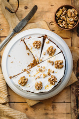 Carrot Cake with Cream Cheese Icing and walnut. Vegan and gluten free concept