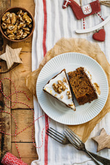 Carrot Cake with Cream Cheese Icing and walnut. Vegan and gluten free concept