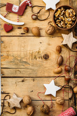 wooden background for your design with nuts and Christmas toys