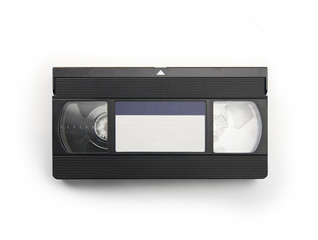 VHS Video cassette tape isolated on white. top view with blue blank label.
