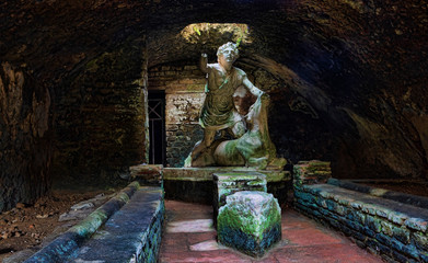 Statue of the god Mithras killing a bull in the thermal s mithraeum in archaeological excavations of Ostia Antica - Rome