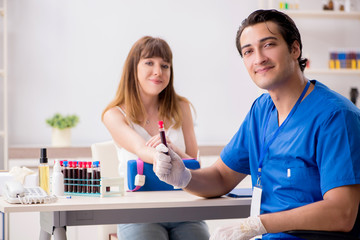 Fototapeta premium Young patient during blood test sampling procedure 