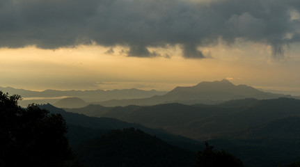 Panorama scenic mountains, misty morning golden sunlight. at Maekampong Chiangai in Thailand.