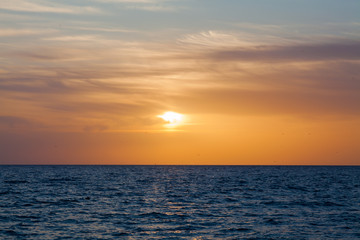 Naklejka na ściany i meble Sunset landscape ocean sea Sun and horizon
