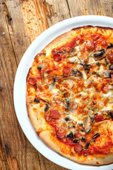 Pizza with salami and mushroom