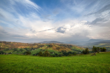 panoramic mountain view with blue cloudy sky