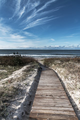 Fototapeta na wymiar Wooden path to Baltic sea.