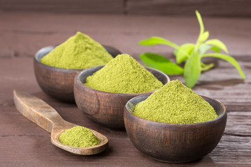 Natural sweetener in powder from stevia plant - Stevia rebaudiana. Top view