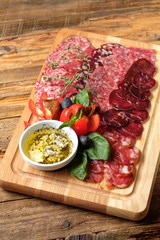 Cutting board with assorted smoked meat