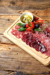 Cutting board with assorted smoked meat