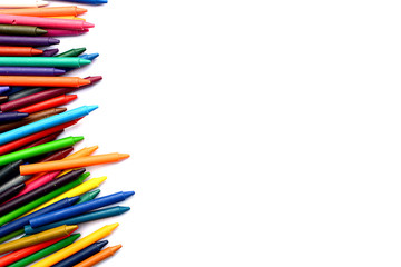Crayons lined up isolated on white background.