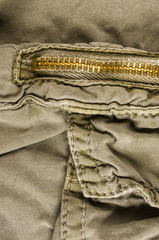 clothing items washed cotton fabric texture with seams, clasps, buttons and rivets