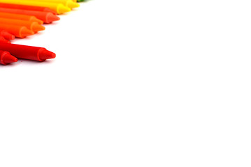 Crayons lined up isolated on white background.