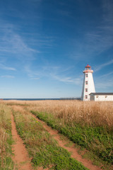 Fototapeta na wymiar Old dirt road road leading to Prince Edward Island Lighthouse at north cape