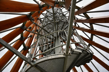 Spiral staircase of lookout tower, construction with metal steps. Observation tower, post or point, place from which to keep watch or view landscape.