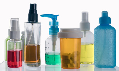 Different types of cosmetic containers and isolated medicines on a white background