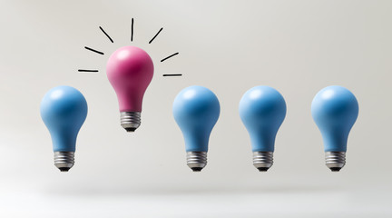 One outstanding idea concept with light bulbs on a gray background