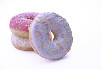 Delicious colorful donuts isolated on white background