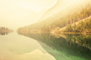 Fototapeta premium Lake Plansee in the European Alps, in Austria at early morning sunshine