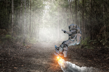 Spaceman on flying board. Mixed media