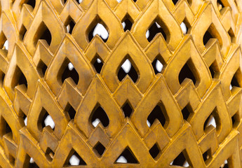Close up view. Gold objects are beautifully shaped and patterned with hole.