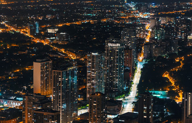 Chicago cityscape and streets at night aerial view