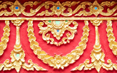 Traditional Thai pattern of the golden stucco.