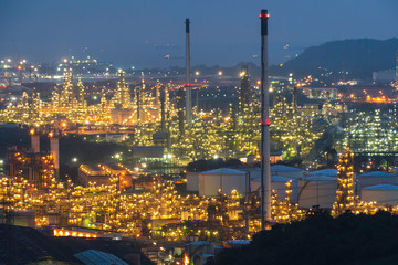 Fototapeta premium Petrochemical Industrial. Oil refinery and Oil industry at twilight