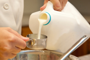 Pouring milk while baking