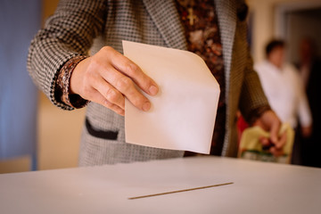 Person voting, casting a ballot