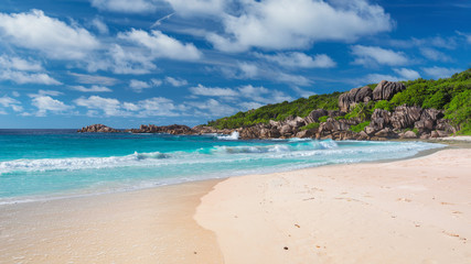 Untouched tropical sandy beach with beautiful rocks and turquoise sea in Paradise island. 