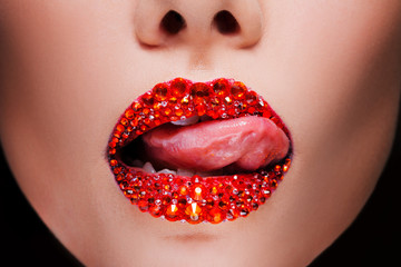 Red lips covered with rhinestones, seductive to lick.