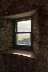 window in the wall with a view of Irish Countryside