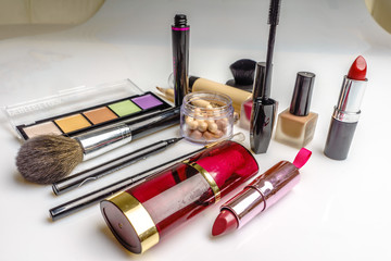 Set of decorative cosmetics, makeup tools and accessory on white background. Professional beauty,...