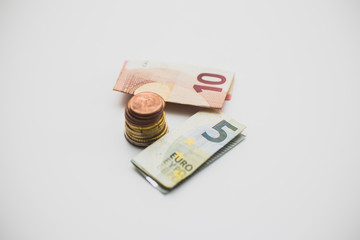 Euro banknotes and coins on a white background - Money, Financial, saving, Growth concept