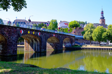 Old bridge in german Alte Brücke in Saarbrücken with the Saarbrücken castle in the background...