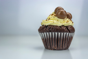 View of white and black cupcake