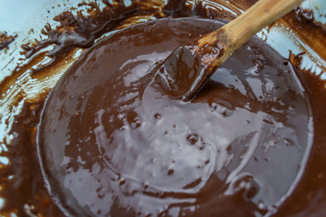 Chocolate texture with wooden spoon