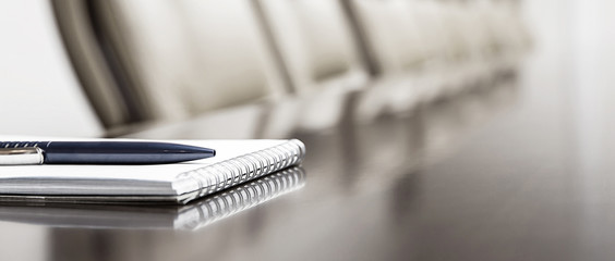 notepad on a table in meeting room