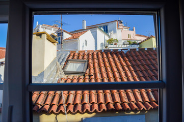 Traditional red house roofs of the Lisbon Portugal outdoor background, top side historic scenic cityscape view.