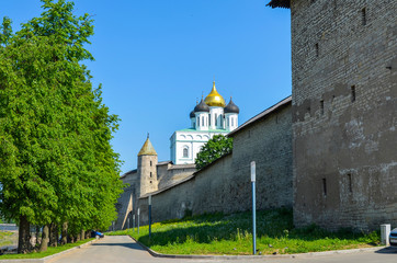 Fototapeta na wymiar Russia. Pskov. Embankment of the Great river at the walls of the Pskov Kremlin. View of Trinity Cathedral