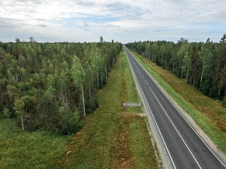 Fototapeta na wymiar road in the forest in the North of Russia