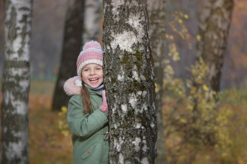 Little girl's portrait in autumn park